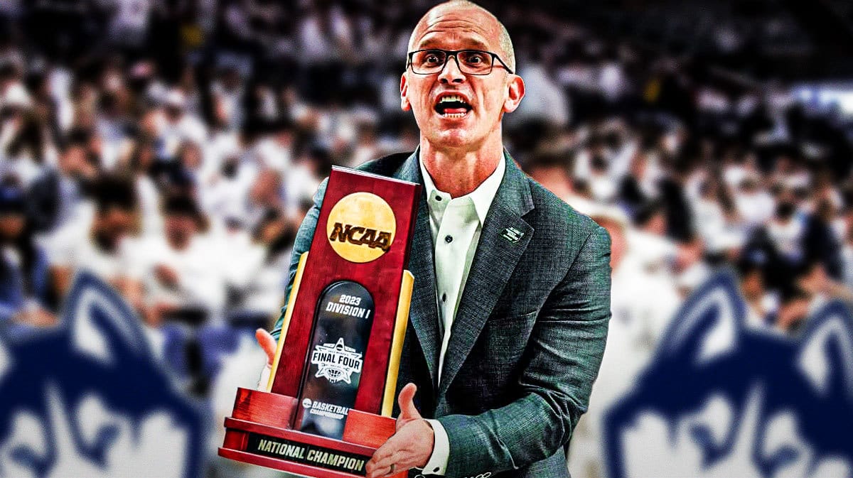 UConn basketball coach Dan Hurley with March Madness trophy.