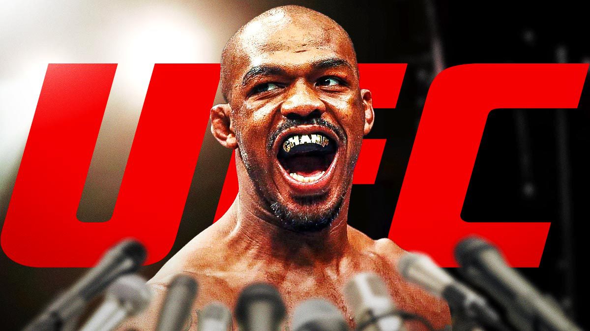 Jon Jones in front of the UFC logo