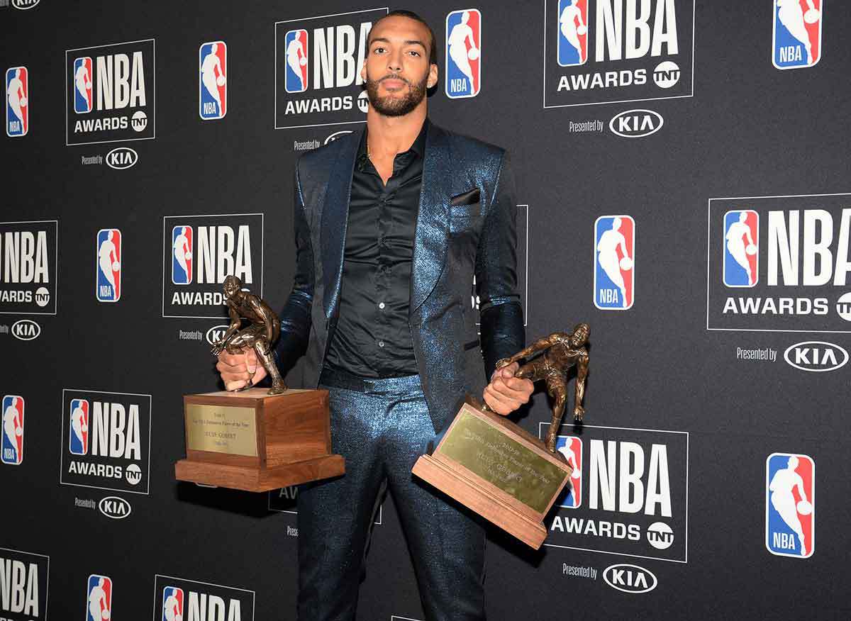 Utah Jazz center Rudy Gobert poses with his defensive player of the year awards at the 2019 NBA Awards show at Barker Hanger.