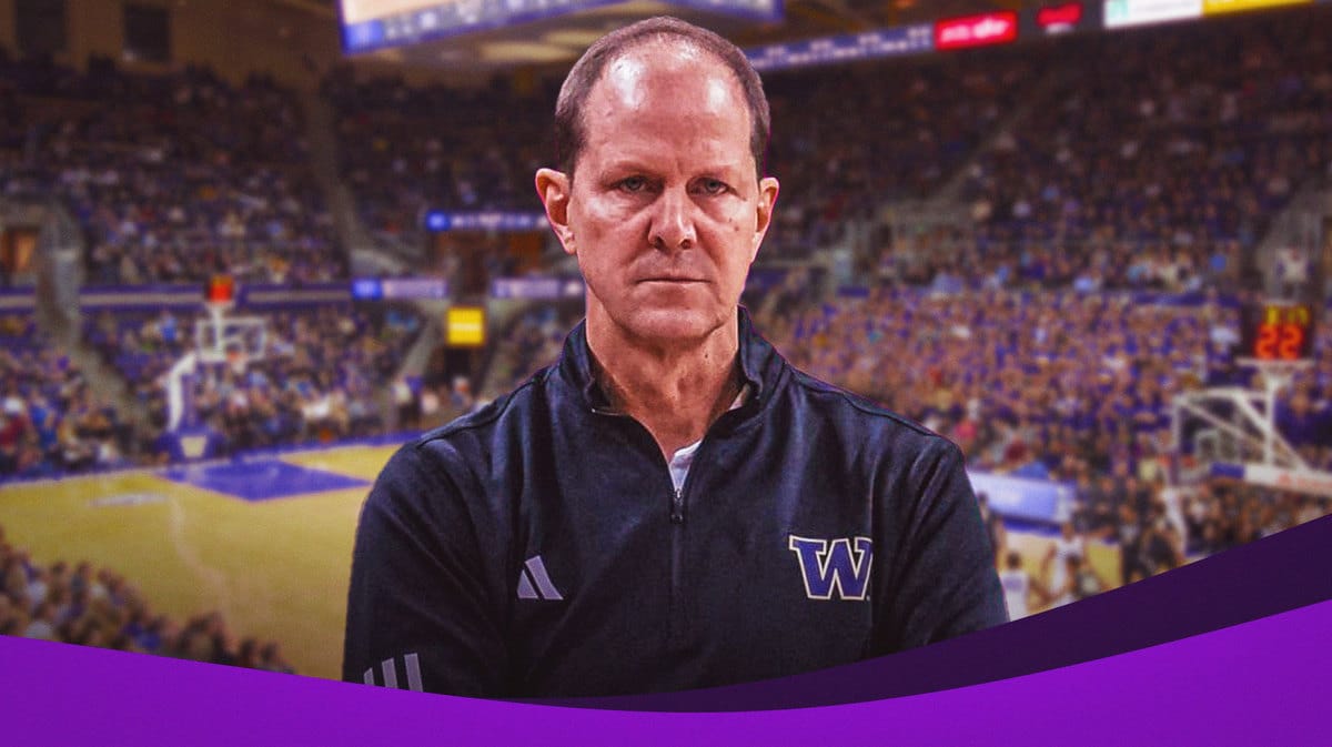 Mike Hopkins looking very emotional with Huskies background