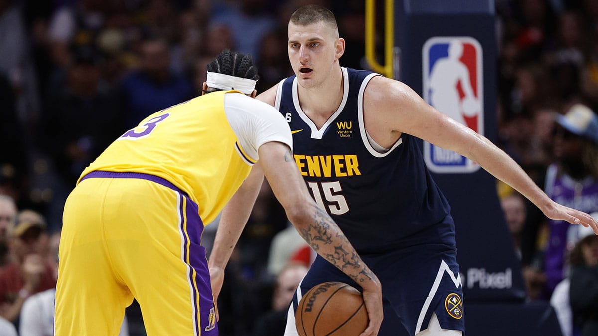 Denver Nuggets center Nikola Jokic (15) guards Los Angeles Lakers forward Anthony Davis (3) in the first half during game two of the Western Conference Finals for the 2023 NBA playoffs at Ball Arena. 