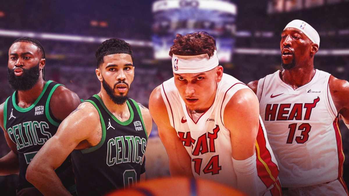 Miami Heat stars Tyler Herro and Bam Adebayo looking at Boston Celtics stars Jayson Tatum and Jaylen Brown in front of the Kaseya Center.