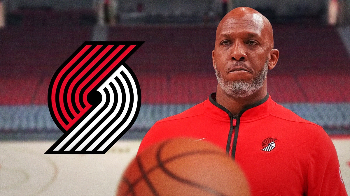 Trail Blazers coach Chauncey Billups stands on court in front of roster