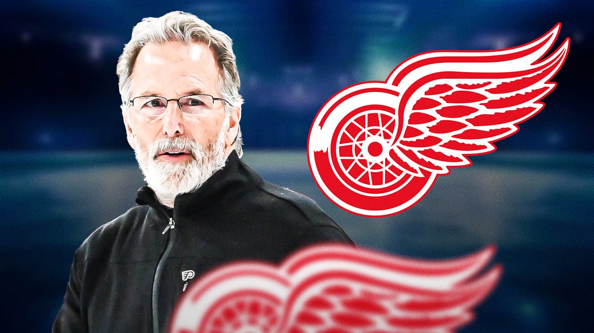 Philadelphia Flyers head coach John Tortorella next to Detroit Red Wings logo
