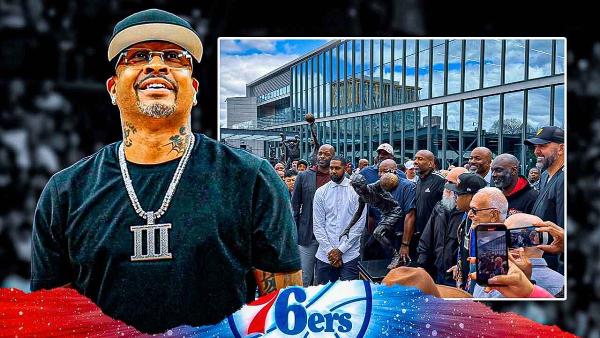 76ers' Allen Iverson next to picture of himself and teammates with new sculpture