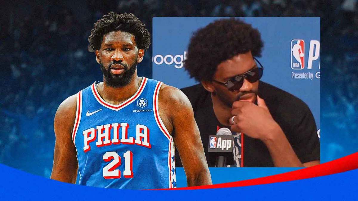 76ers' Joel Embiid in front of a picture of Embiid at the postgame podium in sunglasses