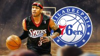 Allen Iverson beside his statue at 76ers Legends Walk. 76ers logo in the background.