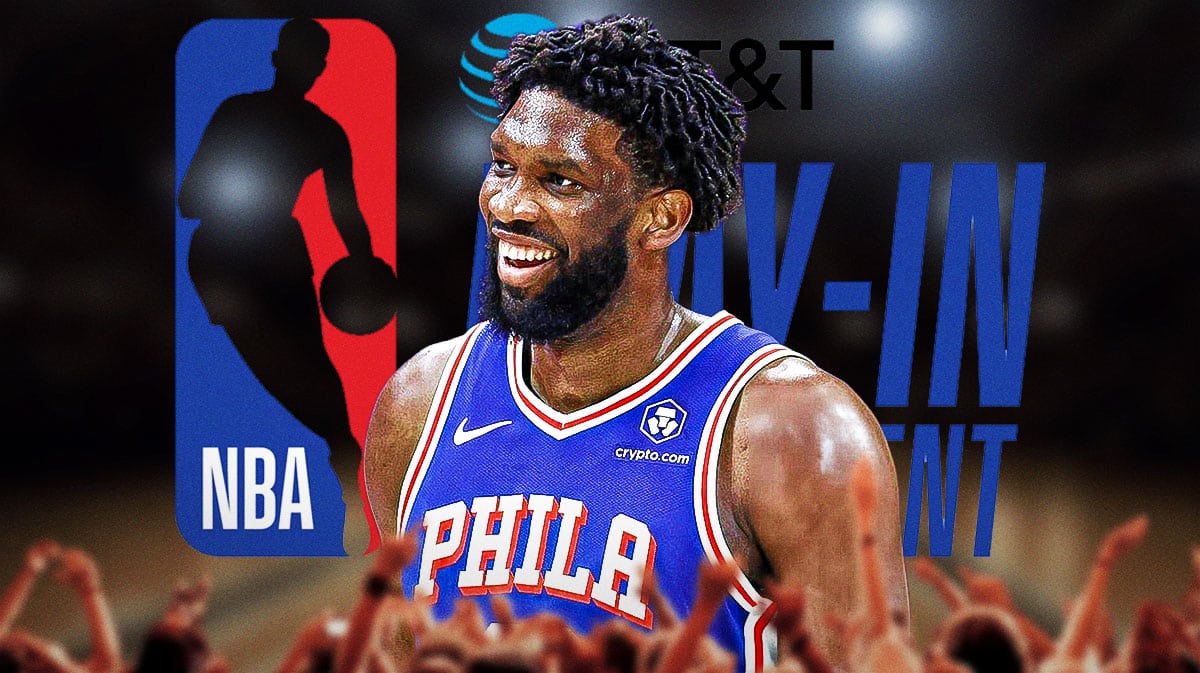 76ers' Joel Embiid in front of the logo for the NBA play-in tournament