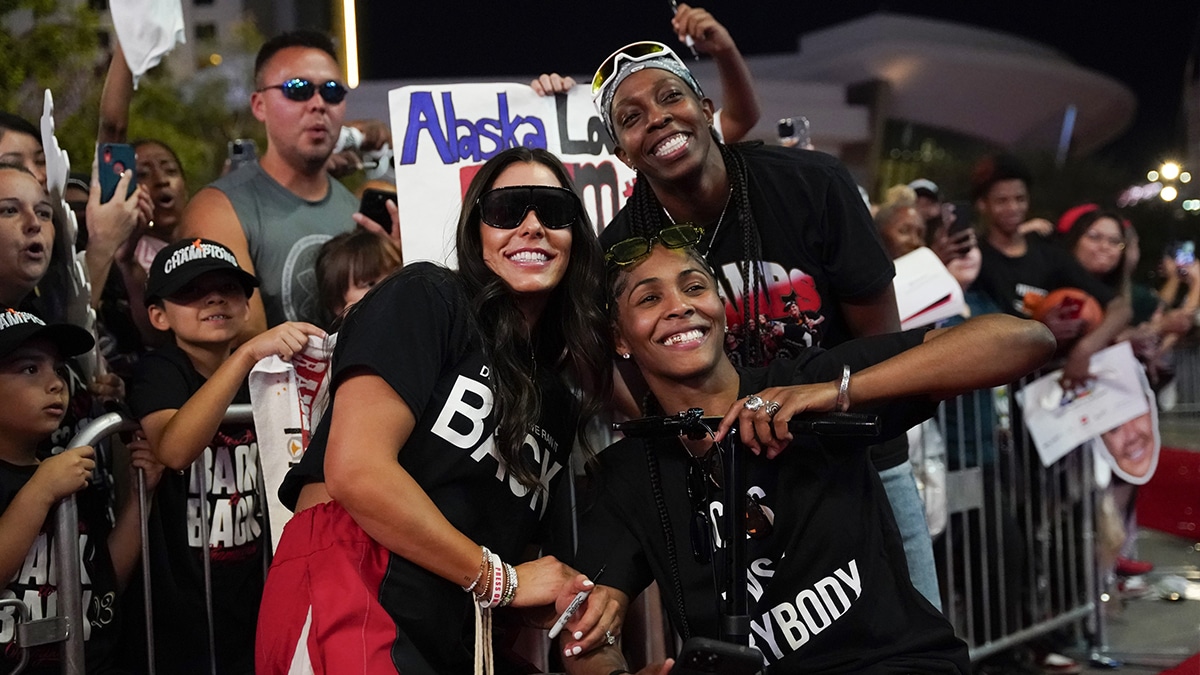  Las Vegas guards Kelsey Plum (10), Sydney Colson (51) and Chelsea Gray (12) pose for a photo op during the Las Vegas Aces championship parade at Toshiba Plaza.