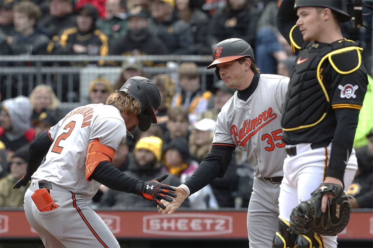 Baltimore Orioles shortstop Gunnar Henderson (2) celebrates his solo home run against the Pittsburgh Pirates with catcher Adley Rutschman (35) during the third inning at PNC Park.