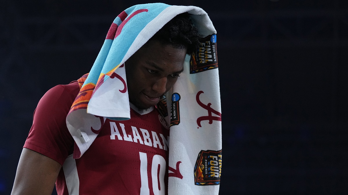 Alabama Crimson Tide forward Mouhamed Dioubate (10) walks off the court after losing to the Connecticut Huskies in the semifinals of the men's Final Four of the 2024 NCAA Tournament at State Farm Stadium.