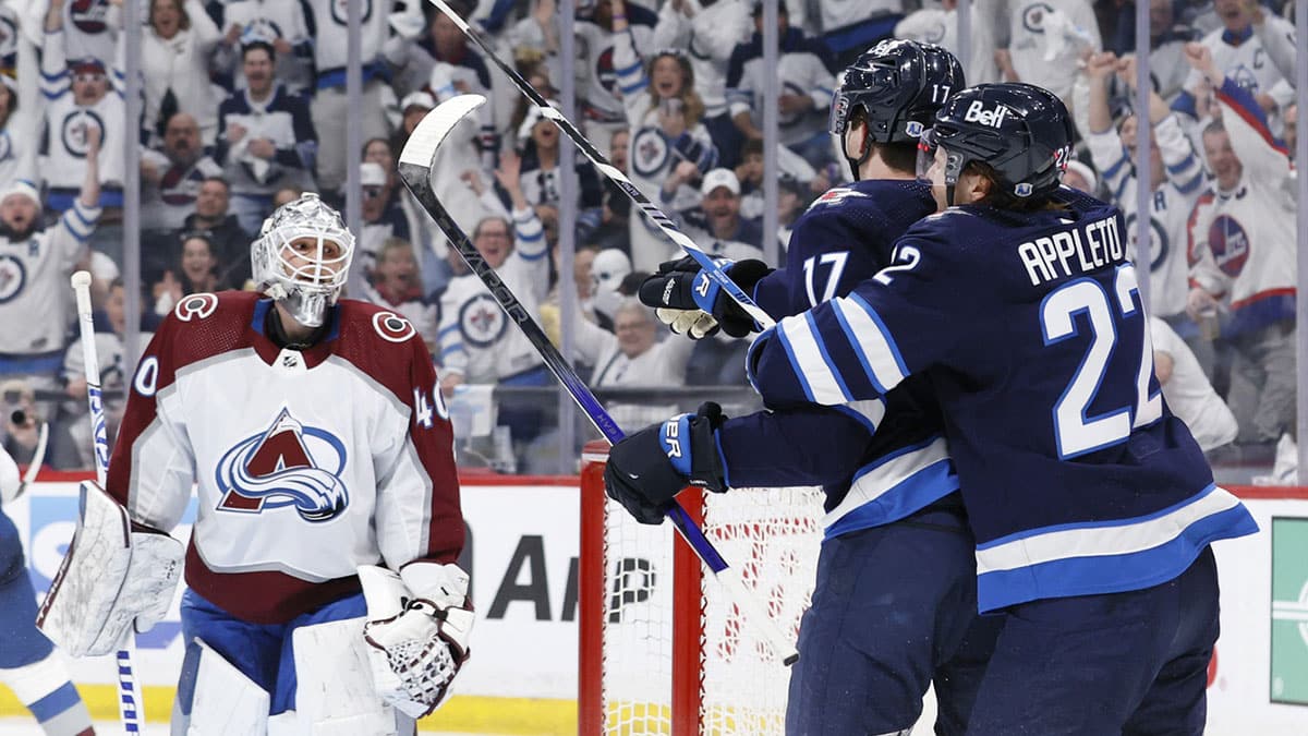 Winnipeg Jets center Mason Appleton (22) celebrates the second period goal by Winnipeg Jets center Adam Lowry (17) on Colorado Avalanche goaltender Alexandar Georgiev (40) in game one of the first round of the 2024 Stanley Cup Playoffs at Canada Life Centre.