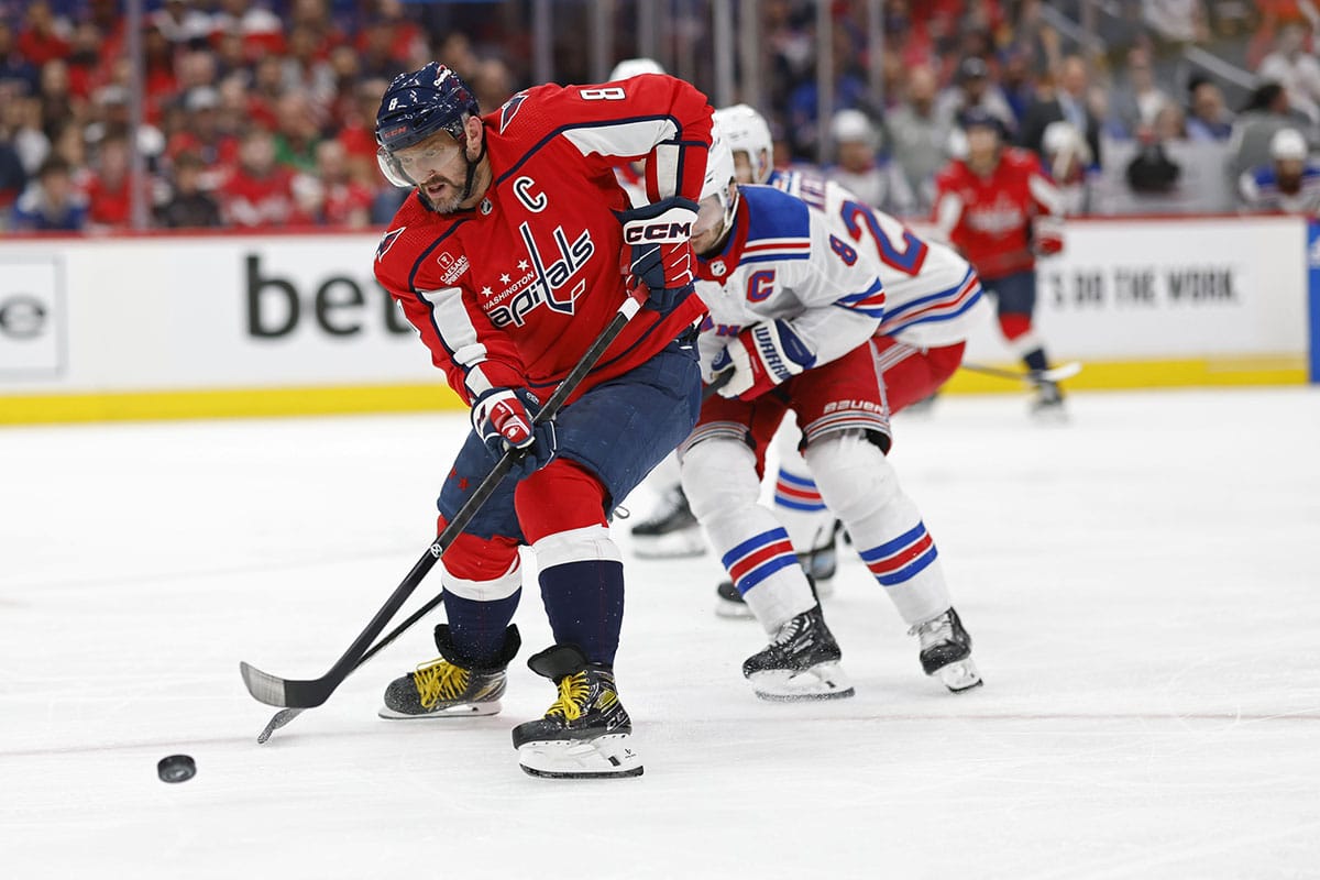 Washington Capitals left wing Alex Ovechkin (8) shoots the puck as New York Rangers defenseman Jacob Trouba (8) defends in the third period in game four of the first round of the 2024 Stanley Cup Playoffs at Capital One Arena. 
