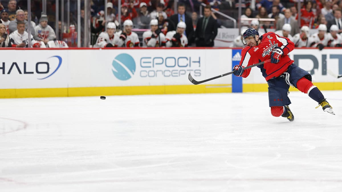 Washington Capitals left wing Alex Ovechkin (8) shoots the puck against the Ottawa Senators in the third period at Capital One Arena.