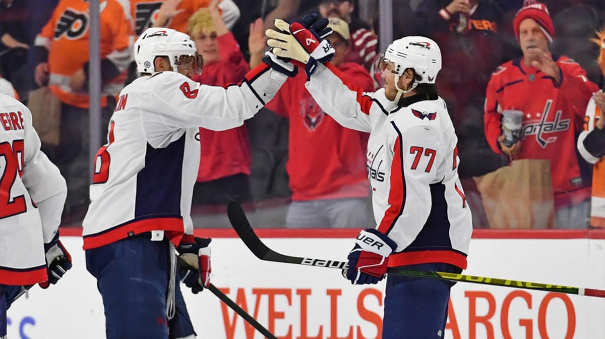Washington Capitals left wing Alex Ovechkin (8) and right wing T.J. Oshie (77) celebrate win against the Philadelphia Flyers at Wells Fargo Center.