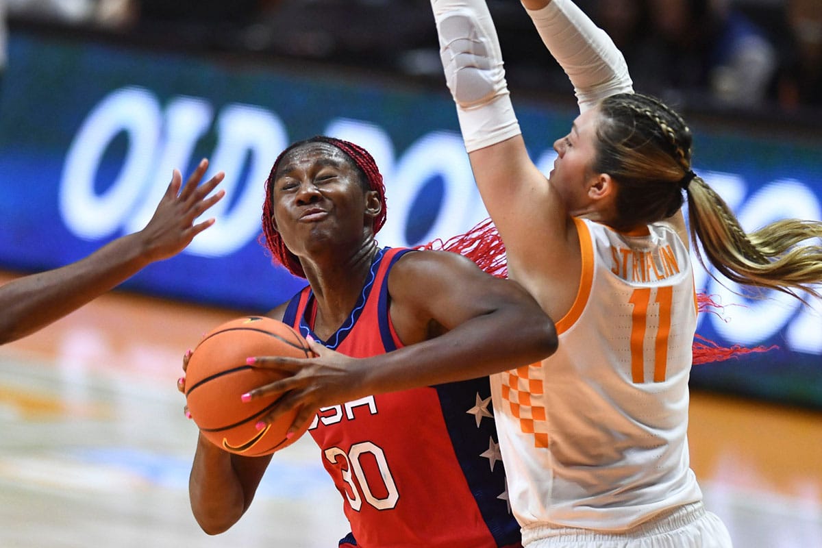 U.S. national team's Aliyah Boston (30) tries to get around Tennessee's Karoline Striplin (11) during an exhibition basketball game