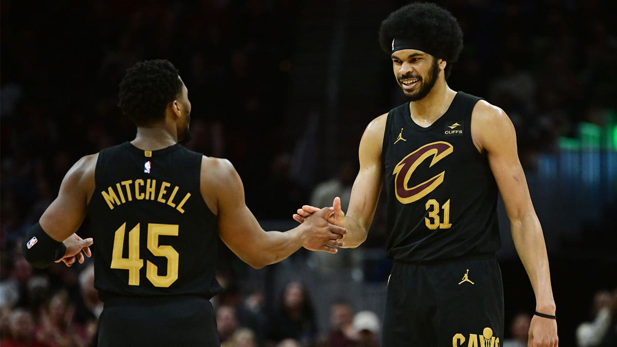 Cleveland Cavaliers guard Donovan Mitchell (45) and center Jarrett Allen (31) celebrate during the second half against the Memphis Grizzlies at Rocket Mortgage FieldHouse. 