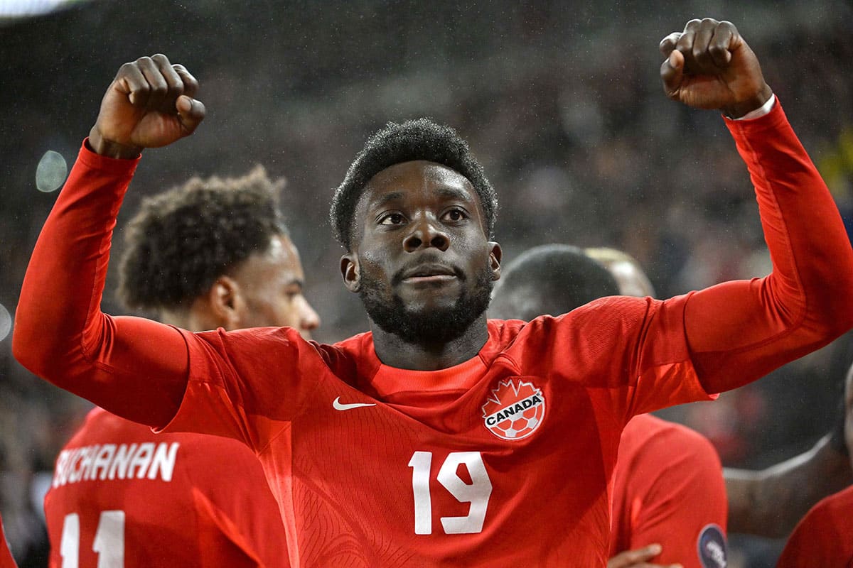 Canada midfielder Alphonso Davies (19) celebrates after scoring a goal against Jamaica in the first half at BMO Field