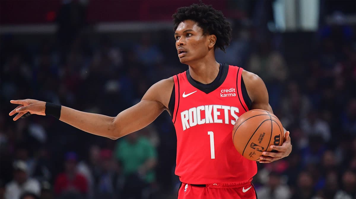 Houston Rockets forward Amen Thompson (1) controls the ball against the Los Angeles Clippers during the first half at Crypto.com Arena.