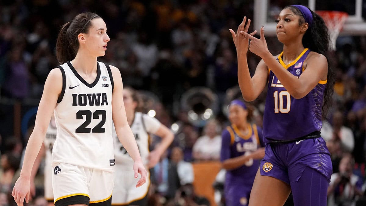 Angel Reese (10) shows Iowa Caitlin Clark her ring finger during the final seconds of the women's NCAA Tournament national championship game. Syndication Hawkcentral