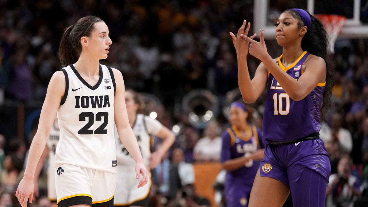 Angel Reese (10) shows Iowa Caitlin Clark her ring finger during the final seconds of the women's 2023 NCAA Tournament national championship game.
