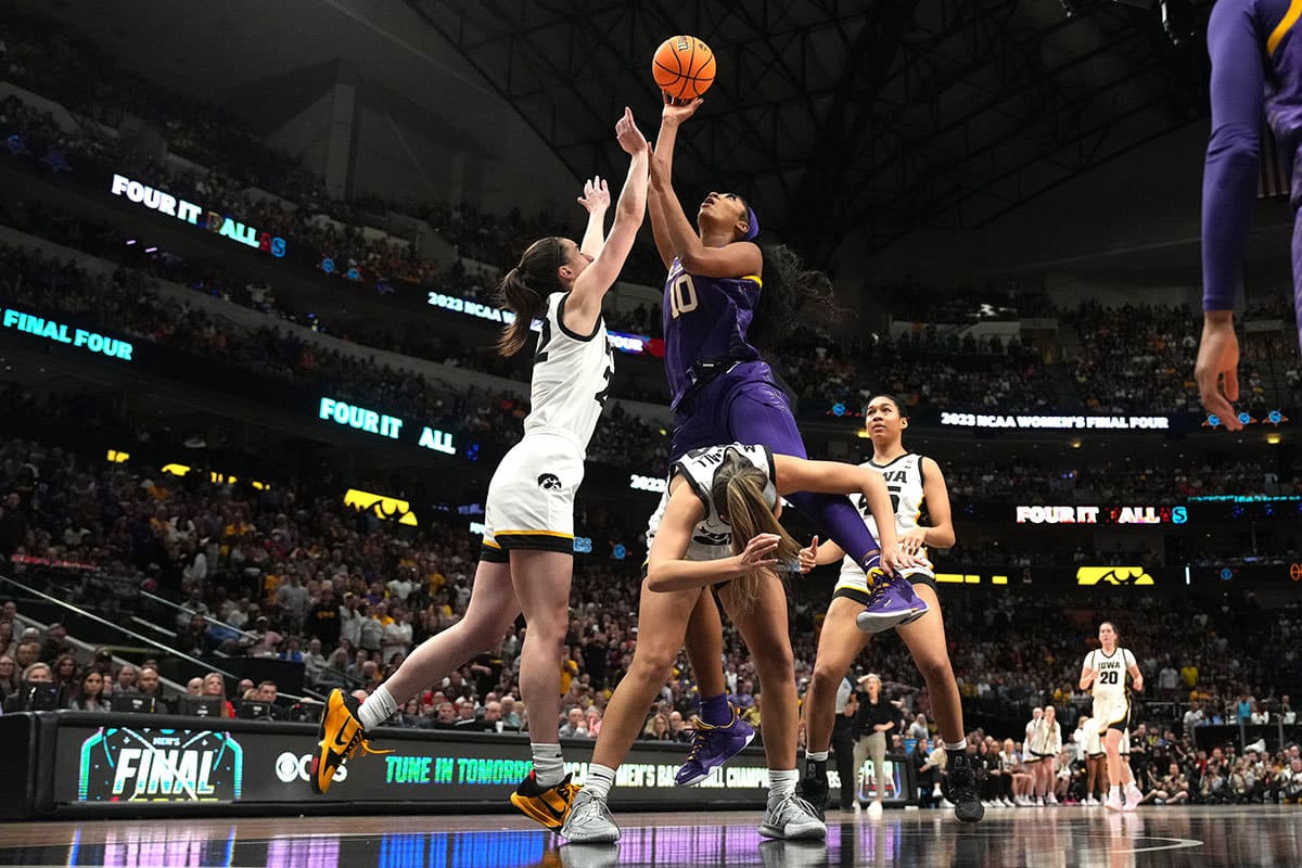 LSU Lady Tigers forward Angel Reese (10) shoots the ball against Iowa Hawkeyes guard Gabbie Marshall (24) and guard Caitlin Clark (22) during the NCAA Womens Basketball Final Four National Championship 