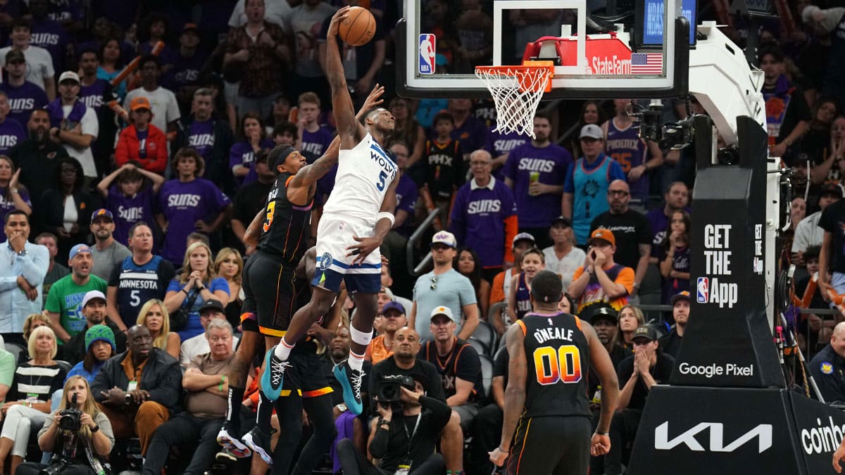 Minnesota Timberwolves guard Anthony Edwards (5) dunks against the Phoenix Suns during the second half of game four of the first round for the 2024 NBA playoffs at Footprint Center.