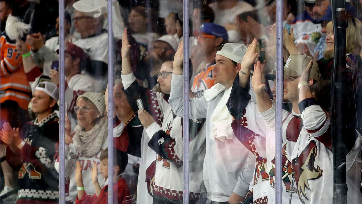 Apr 17, 2024; Tempe, Arizona, USA; Arizona Coyotes fans bang on the glass during the final minute of the game against the Edmonton Oilers at Mullett Arena. Mandatory Credit: Mark J. Rebilas-USA TODAY Sports