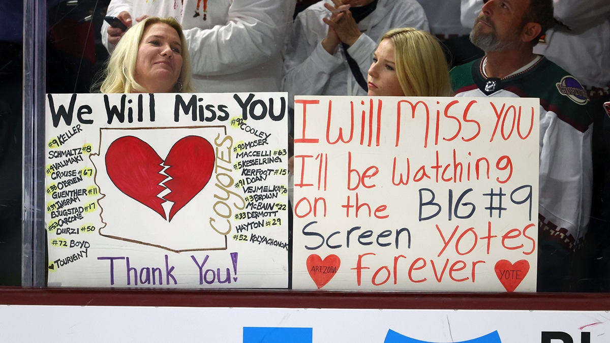 Apr 17, 2024; Tempe, Arizona, USA; Arizona Coyotes fans in the crowd hold signs for the players following the game against the Edmonton Oilers at Mullett Arena. Mandatory Credit: Mark J. Rebilas-USA TODAY Sports