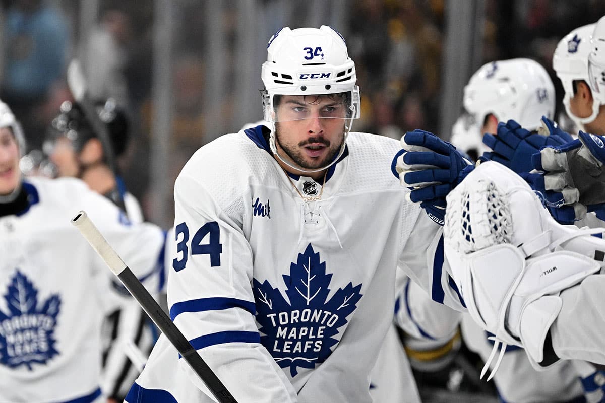 Toronto Maple Leafs center Auston Matthews (34) celebrates with his teammates after scoring a goal against the Boston Bruins during the third period in game two of the first round of the 2024 Stanley Cup Playoffs at TD Garden.