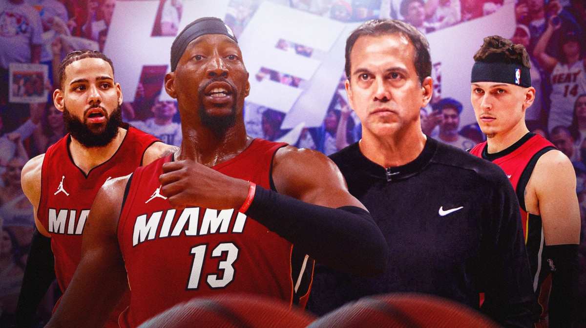 Miami Heat stars Bam Adebayo, Tyler Herro, Caleb Martin, and head coach Erik Spoelstra in front of the fans of the Kaseya Center.