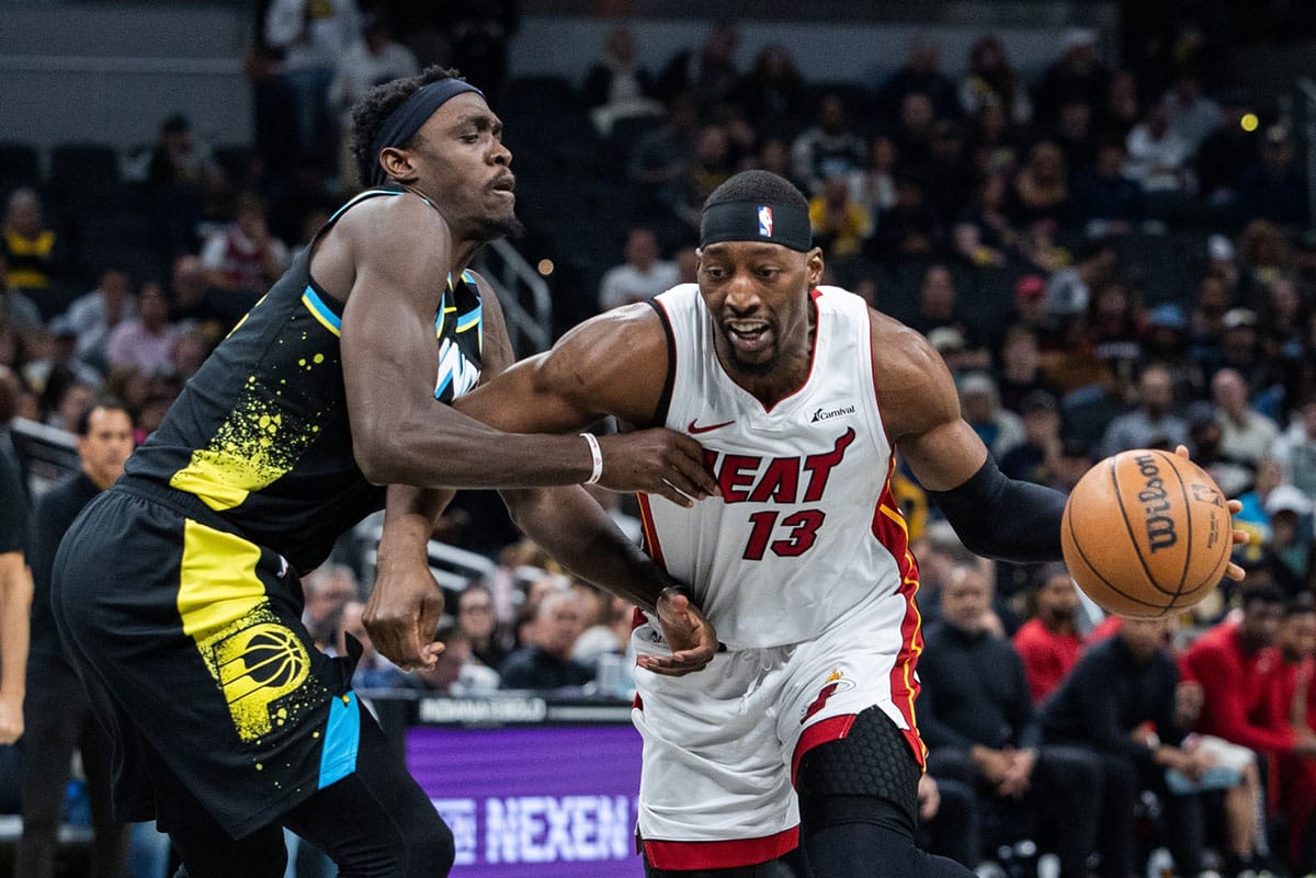 Miami Heat center Bam Adebayo (13) dribbles the ball while Indiana Pacers forward Pascal Siakam (43) defends in the second half at Gainbridge Fieldhouse. 