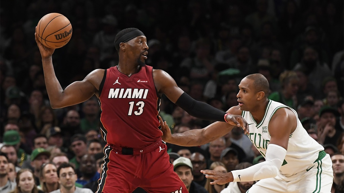 Miami Heat center Bam Adebayo controls the ball as Boston Celtics center Al Horford (42) defends during the second half in game one of the first round for the 2024 NBA playoffs at TD Garden. 