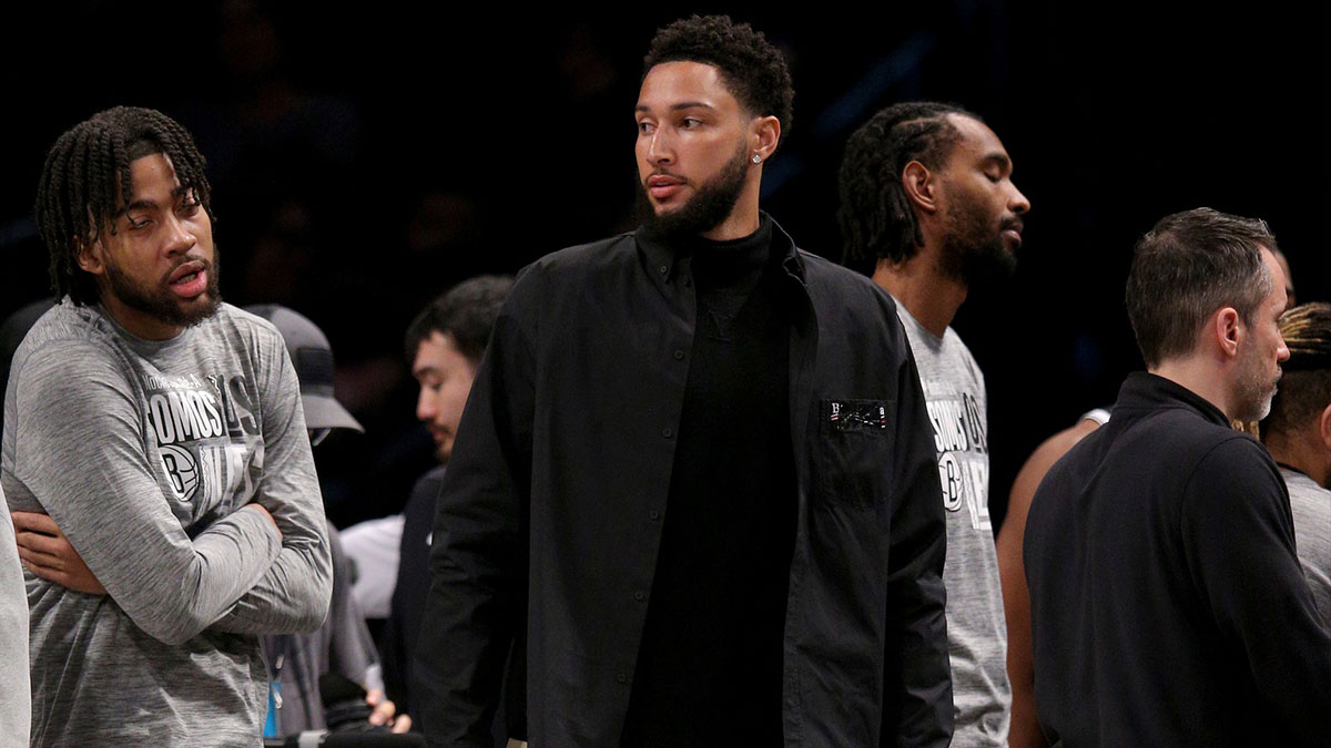Nets' Ben Simmons sits at bench, Jacque Vaughn in background