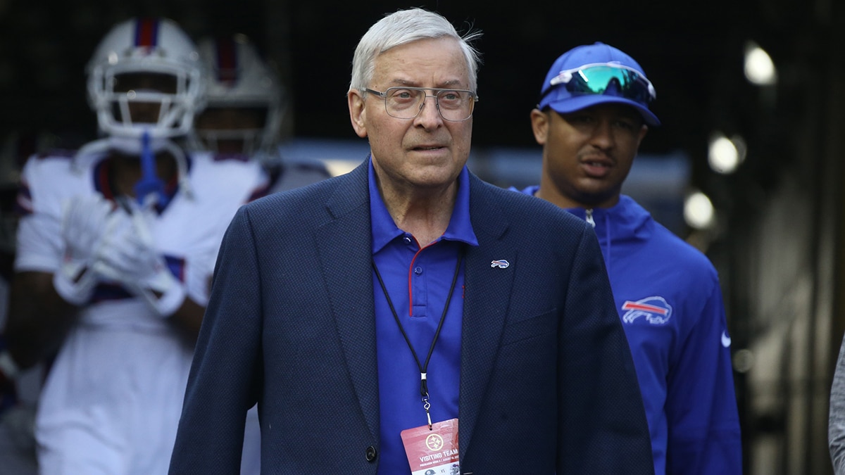 Buffalo Bills owner Terry Pegula (center) walks out to the field to observe warm ups before the game against the Pittsburgh Steelers at Acrisure Stadium.