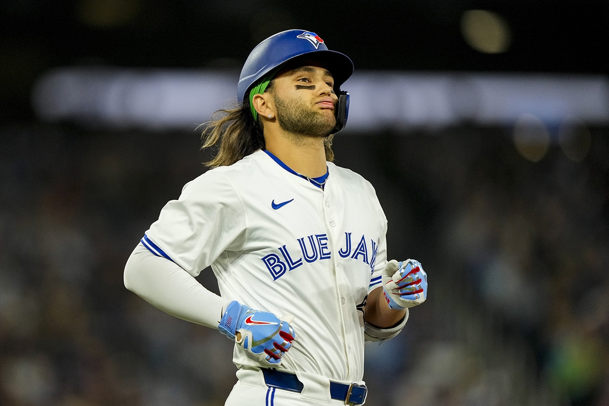 Toronto Blue Jays shortstop Bo Bichette (11) reacts after being called out during the third inning against the Los Angeles Dodgers at Rogers Centre.