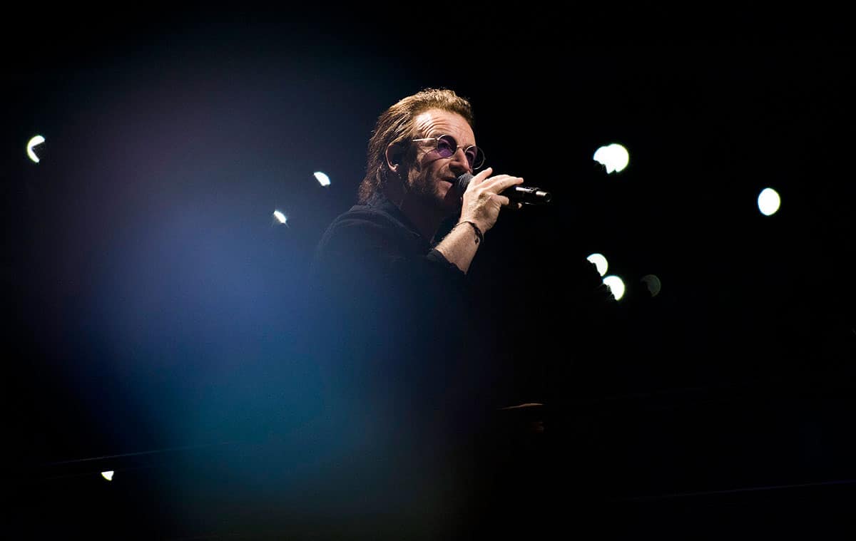 U2 singer Bono performing on the 'Experience + Innocence' tour.