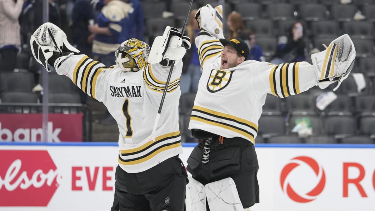 Boston Bruins goaltender Linus Ullmark (right) congratulates goaltender Jeremy Swayman (1) on a win over the Toronto Maple Leafs in game three of the first round of the 2024 Stanley Cup Playoffs at Scotiabank Arena.