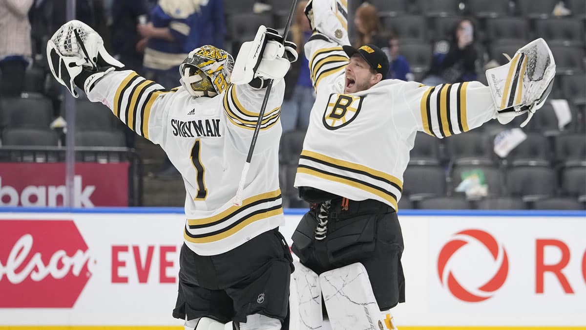 Boston Bruins goaltender Linus Ullmark (right) congratulates goaltender Jeremy Swayman (1) on a win over the Toronto Maple Leafs in game three of the first round of the 2024 Stanley Cup Playoffs at Scotiabank Arena.