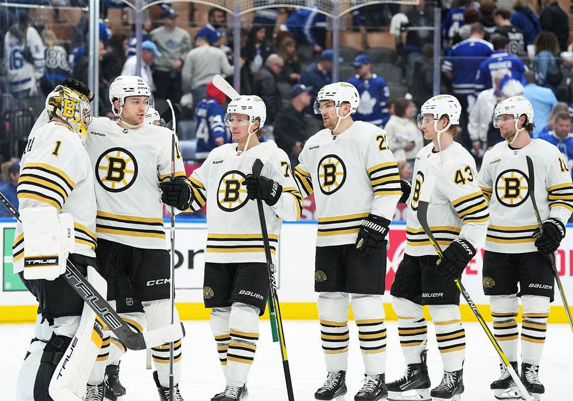 Boston Bruins goaltender Jeremy Swayman (1) and center John Beecher (19) celebrate the win against the Toronto Maple Leafs at the end of the third period in game four of the first round of the 2024 Stanley Cup Playoffs at Scotiabank Arena.