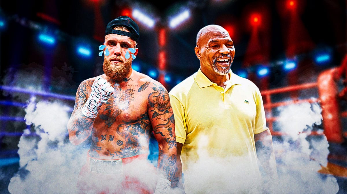 Jake Paul with tears in his eyes, next to a laughing Mike Tyson, a boxing ring behind them