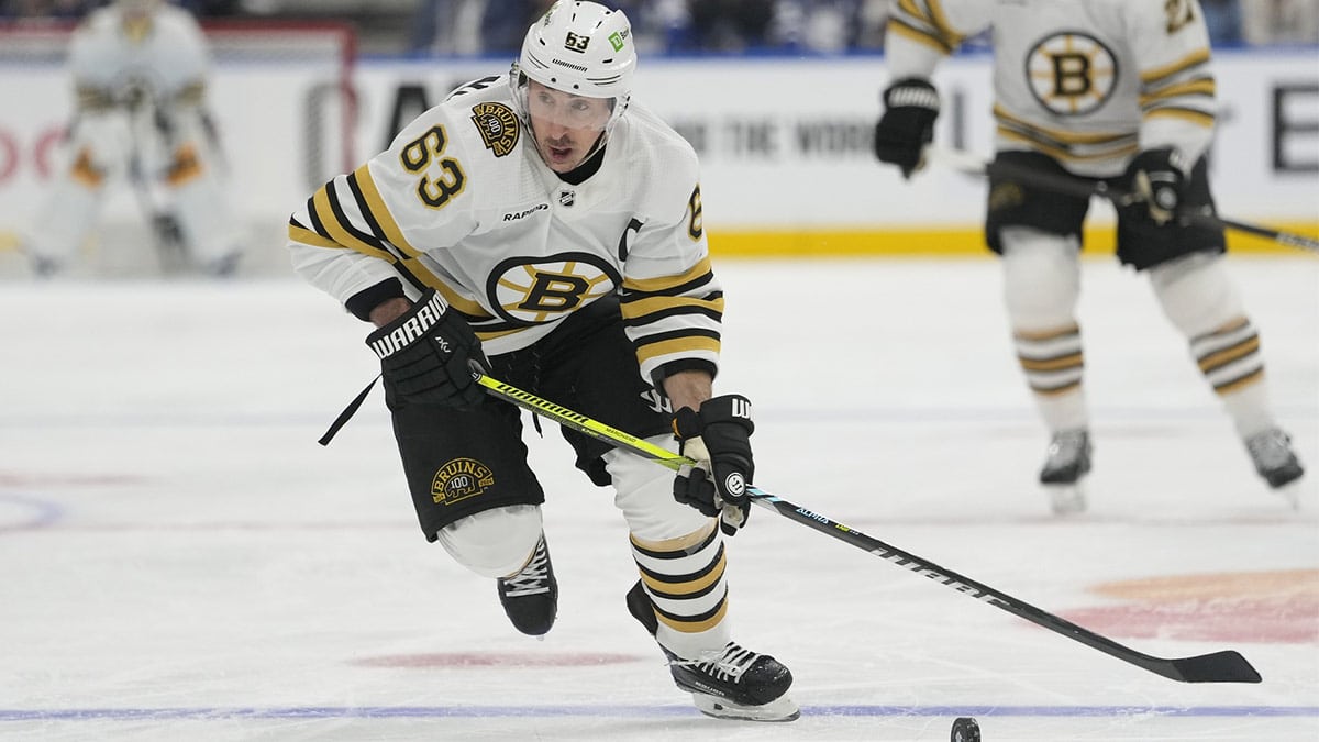 Boston Bruins forward Brad Marchand (63) carries the puck against the Toronto Maple Leafs during the second period of game three of the first round of the 2024 Stanley Cup Playoffs at Scotiabank Arena.