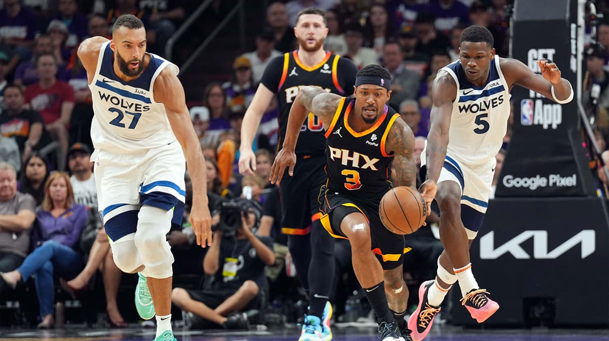Phoenix Suns guard Bradley Beal (3) dribbles by Minnesota Timberwolves guard Anthony Edwards (5) during the second half of game three of the first round for the 2024 NBA playoffs at Footprint Center.
