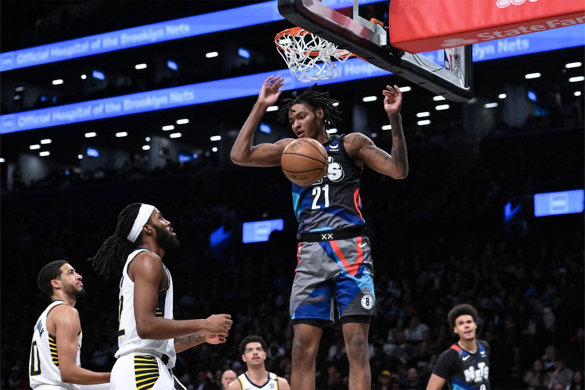 Brooklyn Nets forward Noah Clowney (21) dunks the ball as Indiana Pacers guard Tyrese Haliburton (0) and Indiana Pacers forward Isaiah Jackson (22) look on during the third quarter at Barclays Center. 