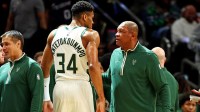 Bucks head coach Doc Rivers talks to forward Giannis Antetokounmpo (34) during the third quarter