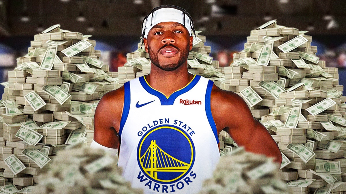 Buddy Hield surrounded by piles of cash.