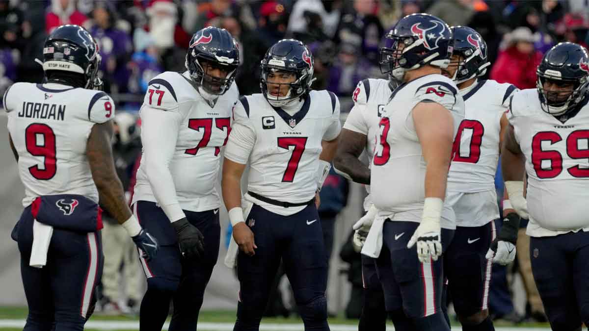 Houston Texans quarterback C.J. Stroud (7) huddles with teammates during the first quarter of a 2024 AFC divisional round game against the Baltimore Ravens at M&T Bank Stadium