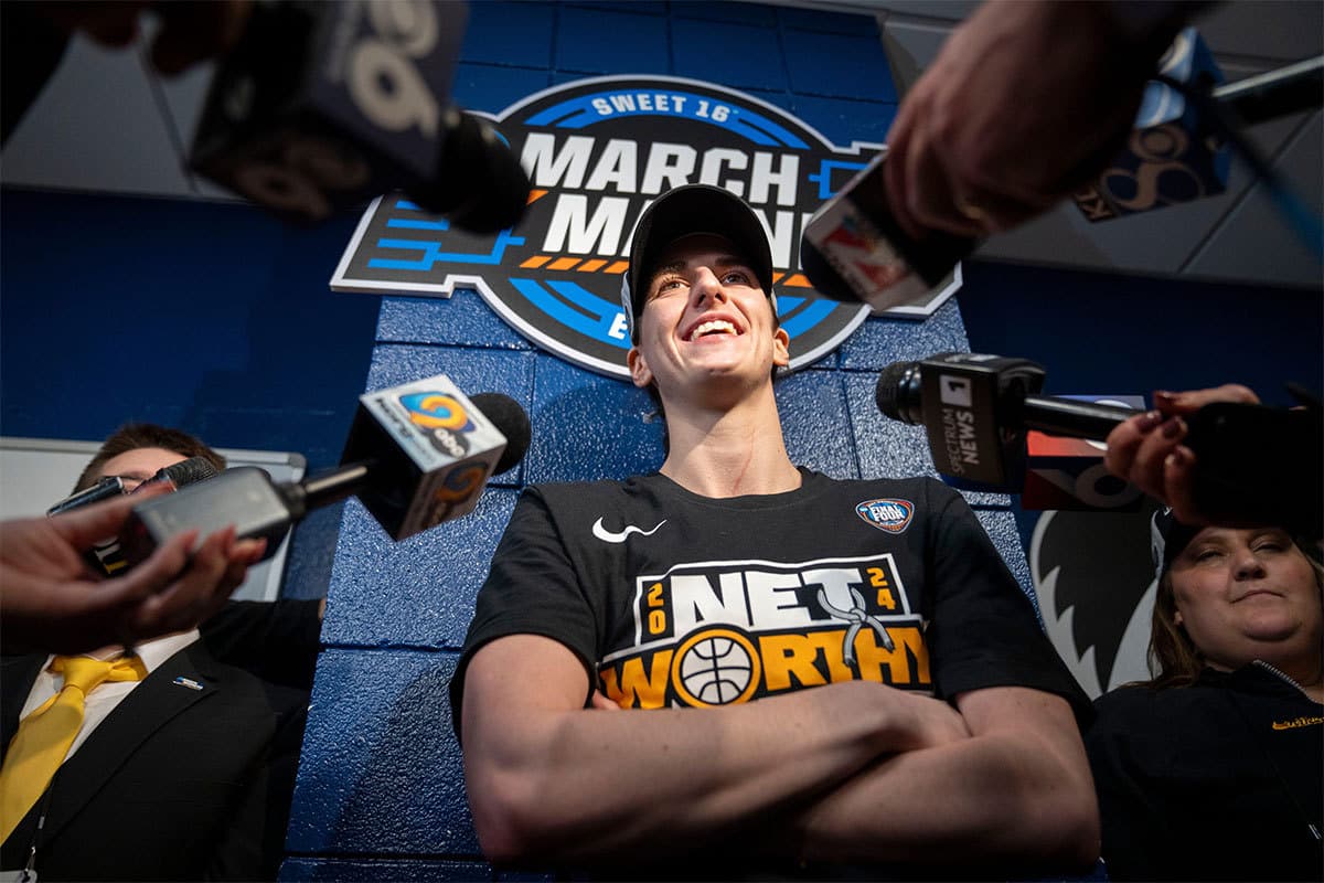 Iowa Hawkeyes guard Caitlin Clark (22) speaks with reporters in the locker room after beating LSU in the Elite 8round of the NCAA Women's Basketball Tournament between Iowa and LSU at MVP Arena, Monday, April 1, 2024 in Albany, N.Y.