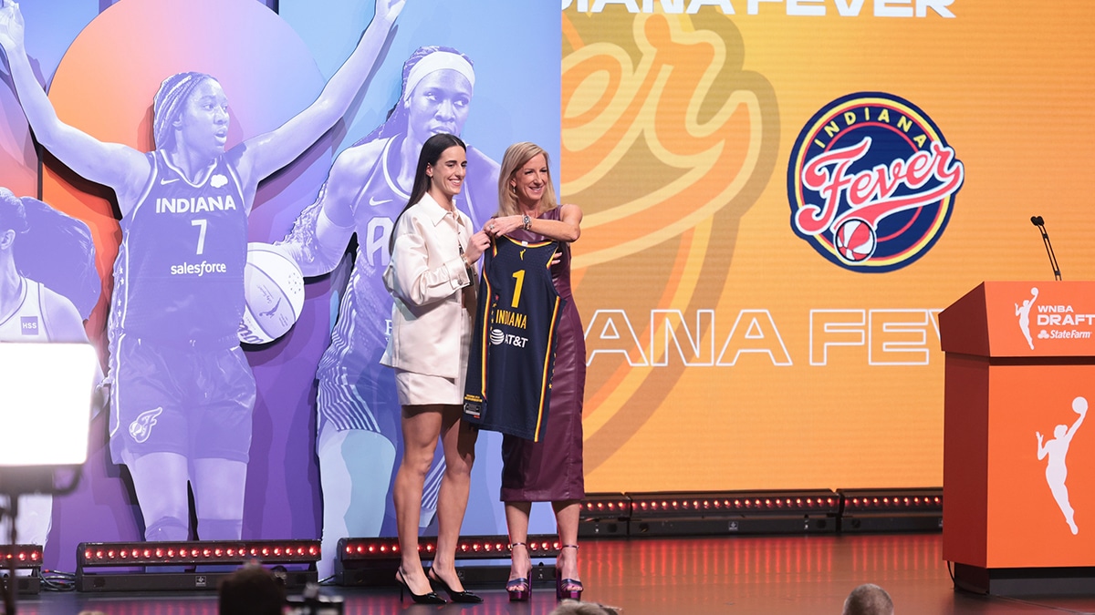 Caitlin Clark poses with WNBA commissioner Cathy Engelbert after she is selected with the number one overall pick to the Indiana Fever in the 2024 WNBA Draft.