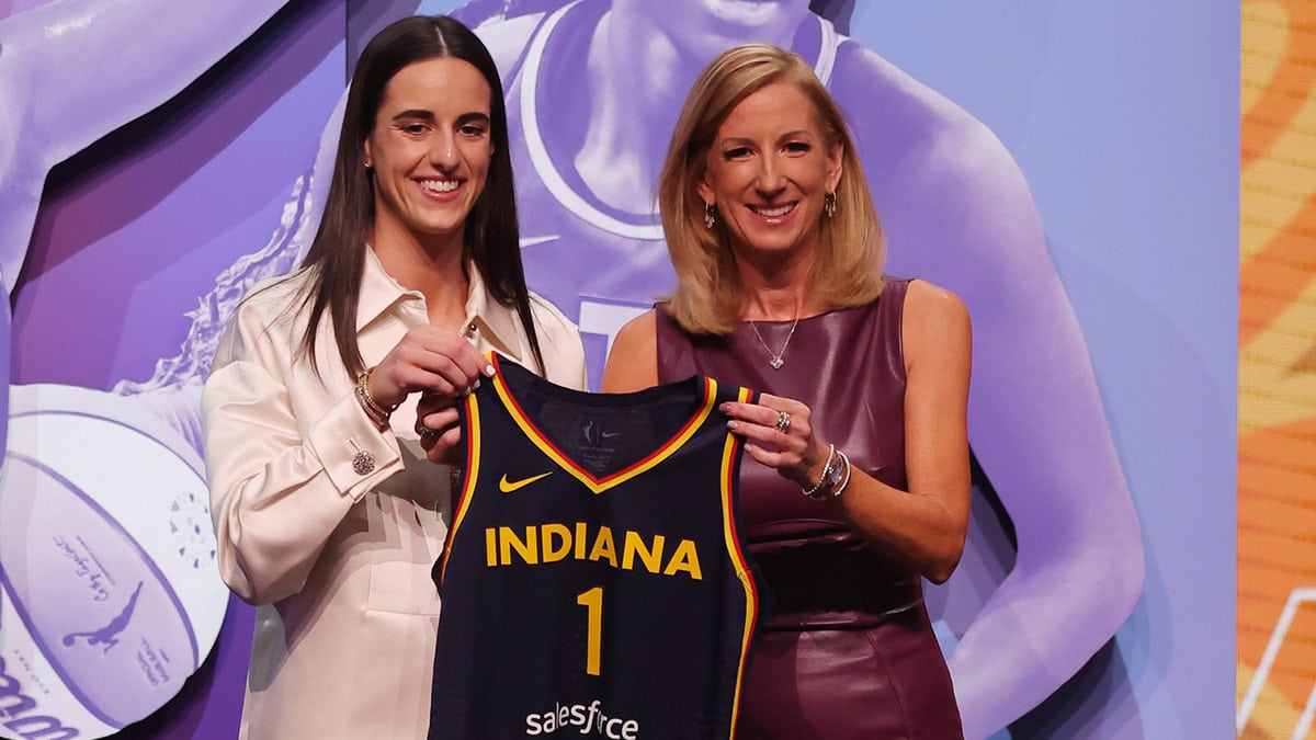 Caitlin Clark poses with WNBA commissioner Cathy Engelbert after she is selected with the number one overall pick to the Indiana Fever in the 2024 WNBA Draft at Brooklyn Academy of Music.